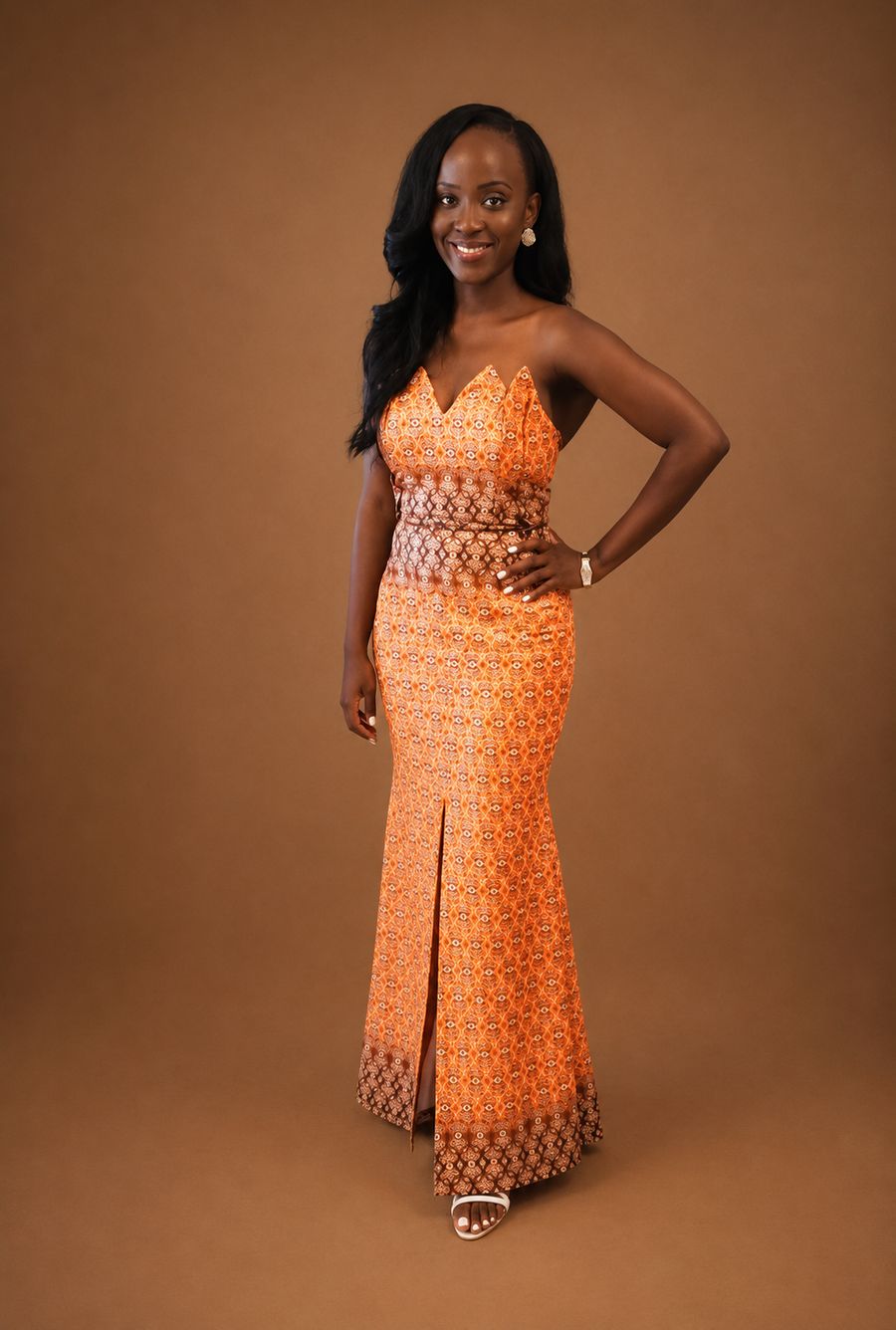 Custom orange Ankara print strapless mermaid gown with notched neckline by Customly Yours Fashion