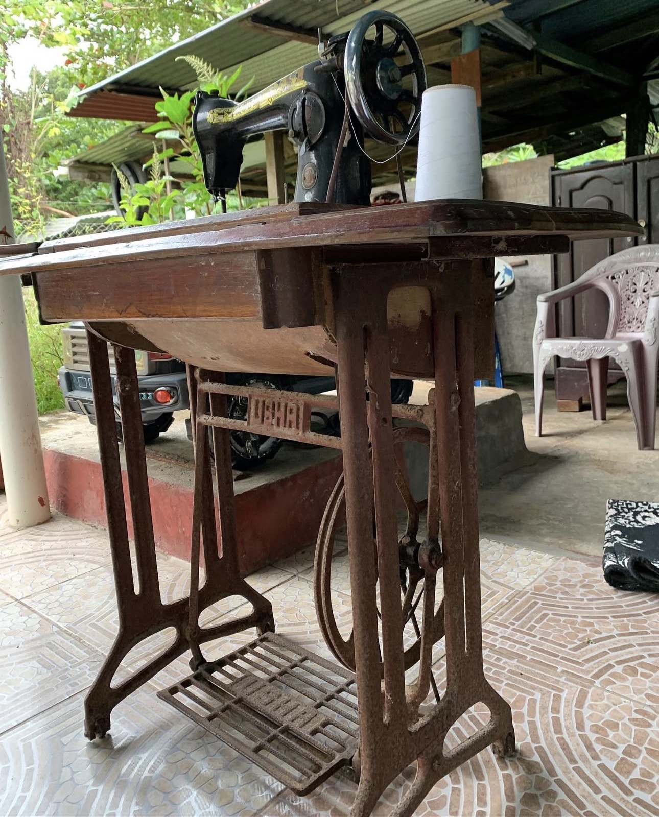 Vintage cast-iron treadle pedal sewing machine, the type Lorraine learned to sew on as a child in Guyana