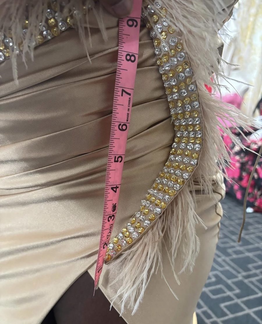 Detailed fitting and alteration of a beaded gown with measuring tape — Customly Yours Fashion